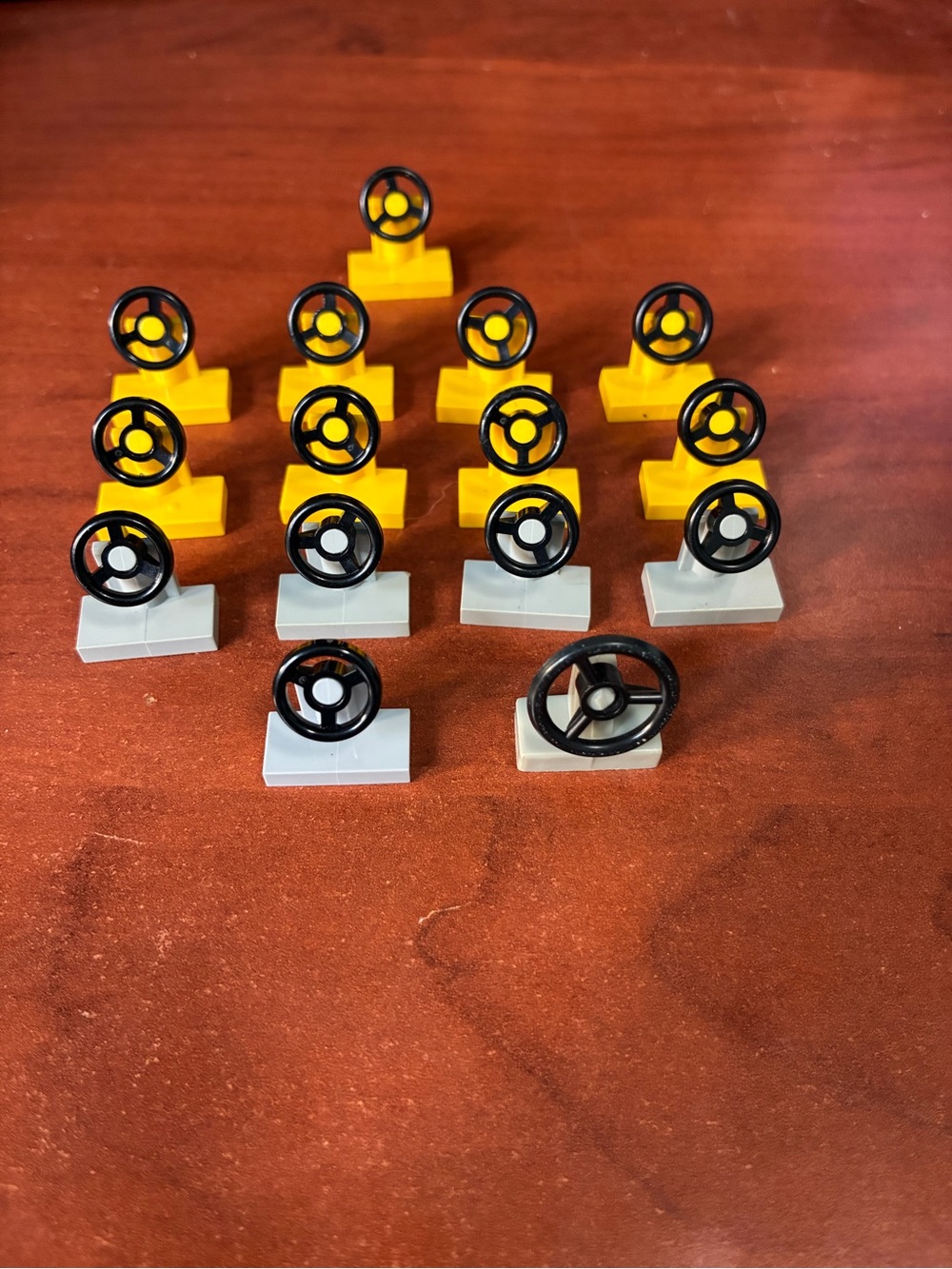 Lego Black Steering Wheels on Yellow and Light Gray Bases
